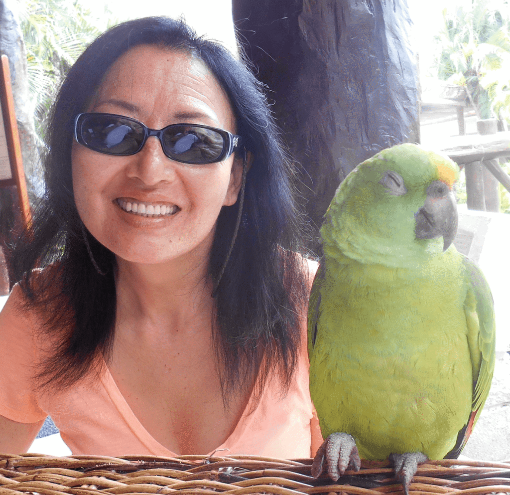 Image of Monica and a parrot